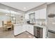 Bright eat-in kitchen featuring stainless steel appliances and white cabinetry at 607 Carolyn Dr, Brandon, FL 33510
