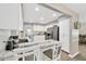 Bright kitchen featuring white cabinetry, stainless steel appliances, and stylish blue marble countertop with seating at 607 Carolyn Dr, Brandon, FL 33510