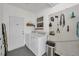 Functional laundry room with modern washer, dryer, and organized storage solutions at 607 Carolyn Dr, Brandon, FL 33510