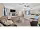 Inviting living room with a comfortable leather sofa, fireplace, and wood flooring at 607 Carolyn Dr, Brandon, FL 33510