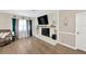 Cozy living room showcases a fireplace, large TV, and stylish decor for relaxing evenings at 607 Carolyn Dr, Brandon, FL 33510