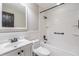 Clean bathroom with white vanity, sleek fixtures, and tiled shower-tub combination at 7012 S Trask St, Tampa, FL 33616