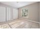 Bright bedroom with tiled floors, closet space and a large window with blinds at 7012 S Trask St, Tampa, FL 33616