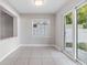Bright dining area with tiled floors and sliding glass doors to the backyard at 7012 S Trask St, Tampa, FL 33616