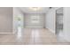 Spacious living room with tile floors and natural light from multiple windows at 7012 S Trask St, Tampa, FL 33616