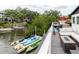 View of the canal with a lounge and firepit on the back deck at 7404 Bay Dr, Tampa, FL 33635
