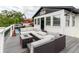 Back deck with a lounge and firepit at 7404 Bay Dr, Tampa, FL 33635