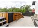 Backyard patio area with covered bar and wooden stools perfect for entertaining at 7404 Bay Dr, Tampa, FL 33635