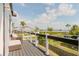 Outdoor deck area with seating offering beautiful green and water views at 7404 Bay Dr, Tampa, FL 33635