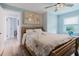 Cozy bedroom featuring a ceiling fan, and a large window with natural light at 7404 Bay Dr, Tampa, FL 33635