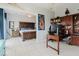 Comfortable bedroom and adjacent office featuring neutral walls, tile floors, and a spacious layout for a functional and inviting space at 7404 Bay Dr, Tampa, FL 33635