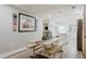 Charming dining area with wood floors, a rustic table, and easy access to the kitchen, perfect for casual meals at 7404 Bay Dr, Tampa, FL 33635