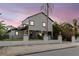 A charming home with a black iron fence at 7404 Bay Dr, Tampa, FL 33635