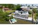 Exterior shot of the home from the water, shows deck and backyard at 7404 Bay Dr, Tampa, FL 33635