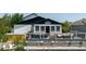Exterior shot of the home with deck and hot tub in backyard at 7404 Bay Dr, Tampa, FL 33635