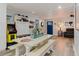 Eclectic living space with a dining table, entertainment center, and unique decor, offering a fun and inviting ambiance at 7404 Bay Dr, Tampa, FL 33635