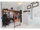 Bright office area boasts large built-in shelving, sleek white filing cabinets, and a ceiling fan for ultimate comfort at 7404 Bay Dr, Tampa, FL 33635