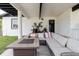 Inviting outdoor patio with ample seating, perfect for relaxing and entertaining guests at 7404 Bay Dr, Tampa, FL 33635