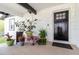 Charming front porch adorned with plants, creating a warm and inviting entrance at 7404 Bay Dr, Tampa, FL 33635