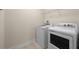 Functional laundry room featuring a washer and dryer, providing convenience for everyday chores at 7699 Windchase Way, Wesley Chapel, FL 33545