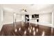 Open-concept living room with hardwood floors and lots of light at 7699 Windchase Way, Wesley Chapel, FL 33545