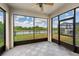 Relaxing screened porch with picturesque lake views, offering an ideal space for outdoor enjoyment at 7699 Windchase Way, Wesley Chapel, FL 33545