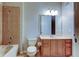 Bathroom with tile flooring and shower-tub combination, with a light wood vanity and large mirror at 7901 Seminole Blvd # 1103, Seminole, FL 33772