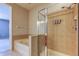 Bathroom with a tub, walk in shower, tile floors, and a towel rack at 7901 Seminole Blvd # 1103, Seminole, FL 33772