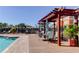 Community pool deck with seating and shade, perfect for relaxing by the water at 7901 Seminole Blvd # 1103, Seminole, FL 33772