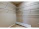 Spacious walk-in closet with white wire shelving and neutral carpet at 7901 Seminole Blvd # 1103, Seminole, FL 33772