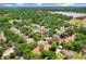 Expansive aerial view of a charming neighborhood featuring mature trees and nearby lake access at 808 Hickory Glen Dr, Seffner, FL 33584