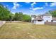 Expansive back yard featuring a mature tree and a wood fence, offering privacy at 808 Hickory Glen Dr, Seffner, FL 33584