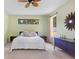 Comfortable bedroom with a decorative ceiling fan and a large window at 808 Hickory Glen Dr, Seffner, FL 33584