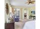 Cozy bedroom featuring a ceiling fan, a chair, and a sliding glass door at 808 Hickory Glen Dr, Seffner, FL 33584