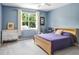Stylish bedroom featuring a comfortable bed, matching furnishings and a window at 808 Hickory Glen Dr, Seffner, FL 33584