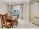 Bright dining room with a wooden table, natural light, and soft-colored walls at 808 Hickory Glen Dr, Seffner, FL 33584