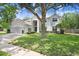 Charming two-story home with a well-manicured lawn and inviting curb appeal at 808 Hickory Glen Dr, Seffner, FL 33584