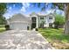 Charming two-story home with a well-manicured lawn, attached garage, and inviting curb appeal at 808 Hickory Glen Dr, Seffner, FL 33584