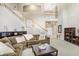 Inviting living room featuring a staircase, comfortable seating, and stylish decor at 808 Hickory Glen Dr, Seffner, FL 33584