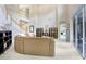 Bright living room with a soaring ceiling, staircase, comfortable seating, and natural light at 808 Hickory Glen Dr, Seffner, FL 33584
