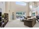 Spacious living room with high ceilings, access to outdoor patio, and comfortable seating at 808 Hickory Glen Dr, Seffner, FL 33584