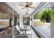 Inviting screened-in porch features furniture, ceiling fans, and a view of the spacious backyard at 808 Hickory Glen Dr, Seffner, FL 33584