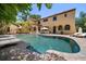 Resort-style backyard featuring a large pool, lounge chairs, and lush landscaping at 843 17Th N Ave, St Petersburg, FL 33704