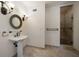 Elegant bathroom with pedestal sink, decorative mirror and shower at 843 17Th N Ave, St Petersburg, FL 33704