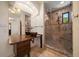 Bathroom showcasing dual copper sinks, decorative lighting, and a glass shower with tiled walls at 843 17Th N Ave, St Petersburg, FL 33704