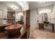 Bathroom featuring dual copper bowl sinks, unique lighting, and decorative mirrors in an elegant setting at 843 17Th N Ave, St Petersburg, FL 33704