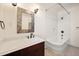 Bathroom featuring a classic clawfoot tub, a stylish vanity with dark wood and elegant tile floor at 843 17Th N Ave, St Petersburg, FL 33704