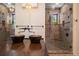 Elegant bathroom featuring dual copper sinks, shower with glass doors, and designer light fixtures at 843 17Th N Ave, St Petersburg, FL 33704
