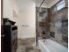 Bathroom featuring custom tiled shower, neutral paint, and dark wood vanity at 843 17Th N Ave, St Petersburg, FL 33704