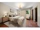 Serene bedroom with neutral tones, tufted headboard, and bright windows at 843 17Th N Ave, St Petersburg, FL 33704